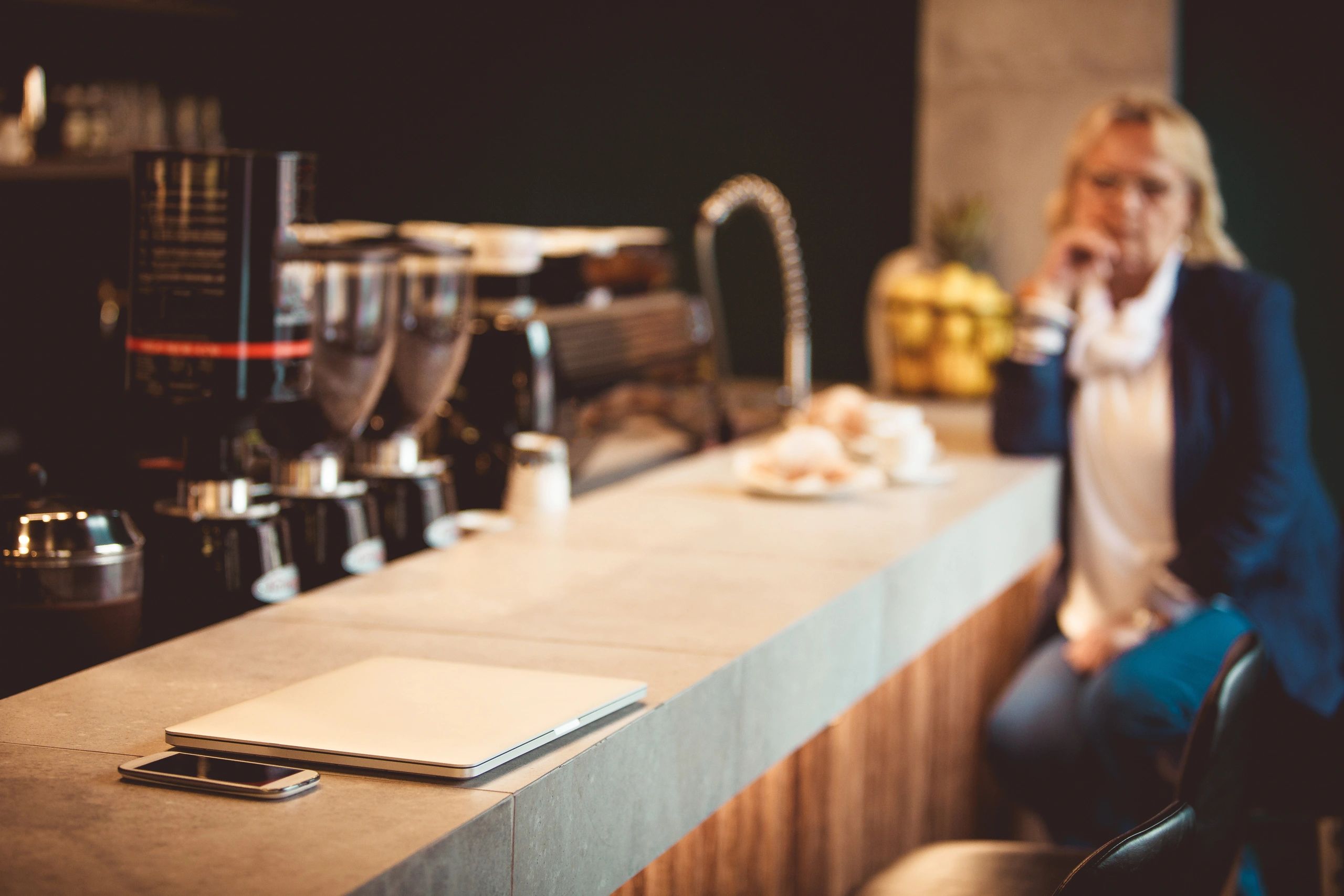 Premium café-style workspace representing customer account access and support