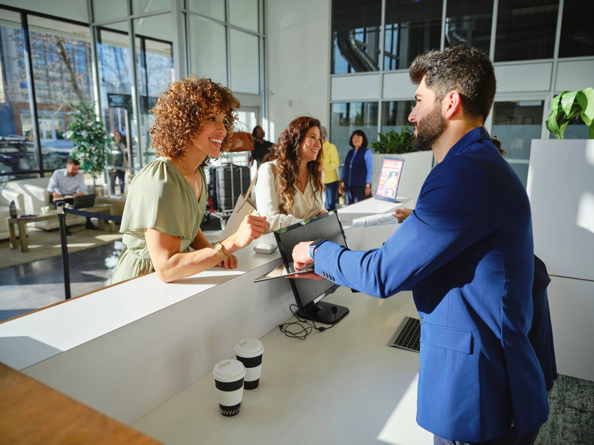 Hotel reception with guests checking in