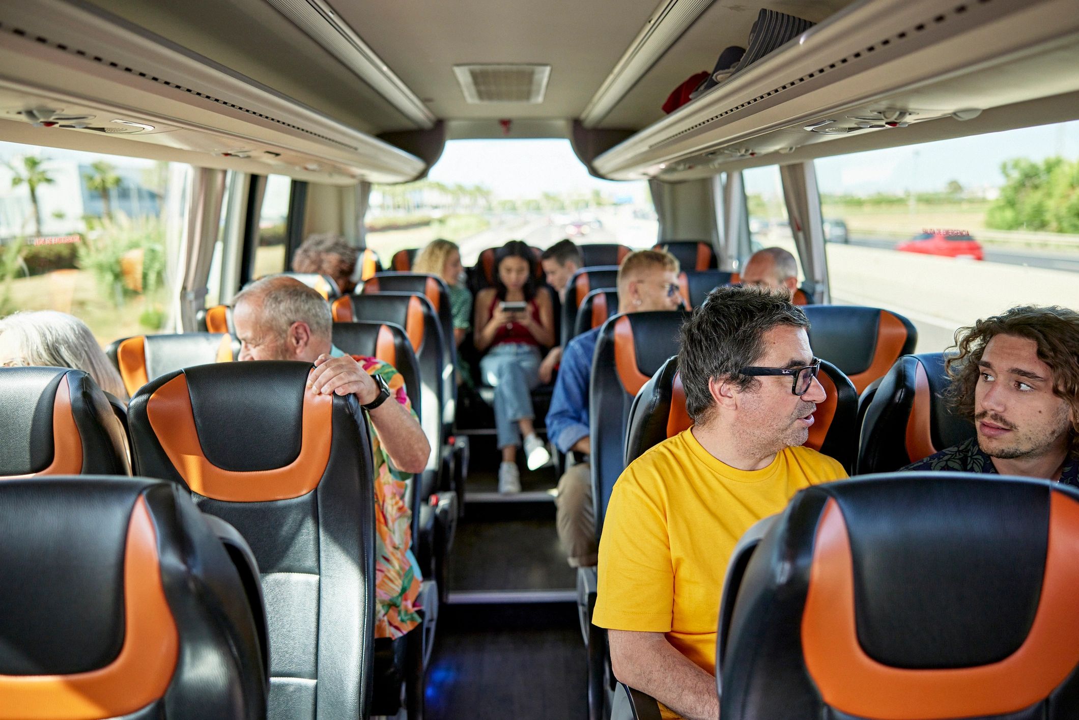 Family travelers riding together on a comfortable coach
