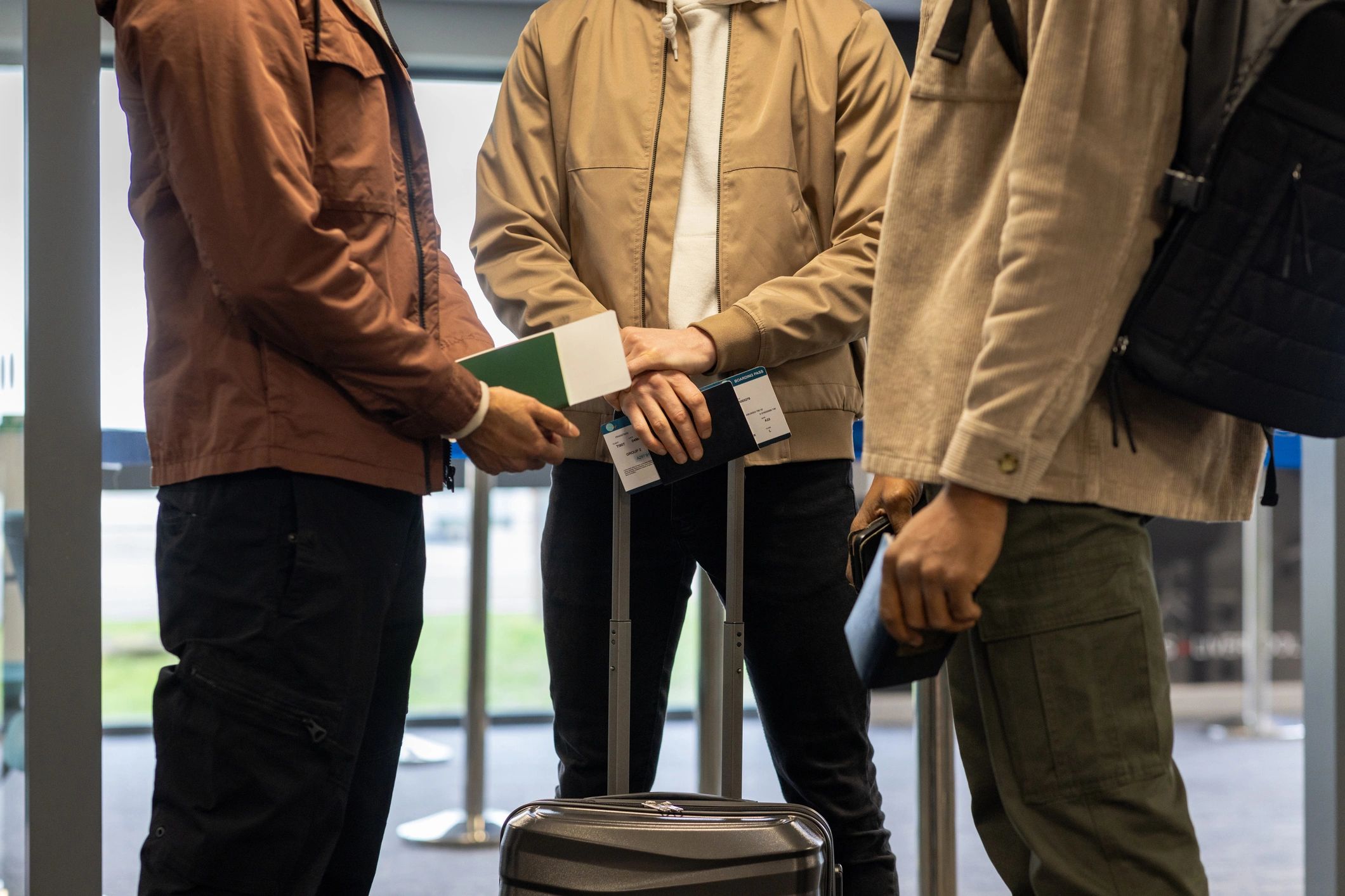 Travelers waiting in an airport check-in line