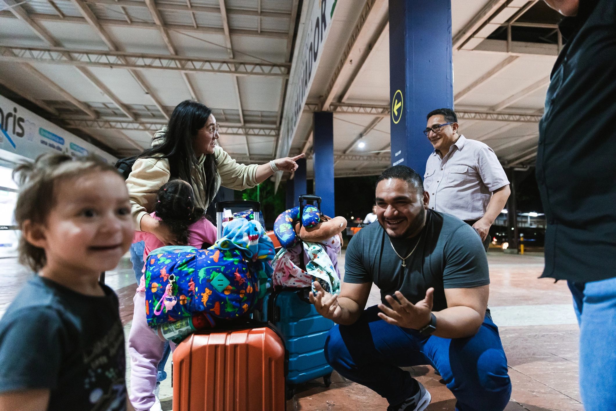 Travelers reuniting outside an airport