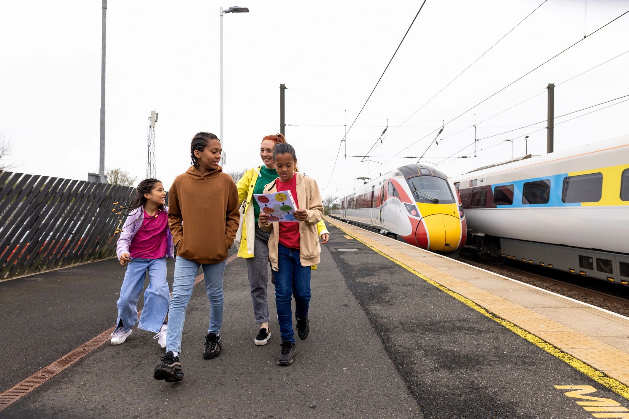 Family arriving for travel at a railway station