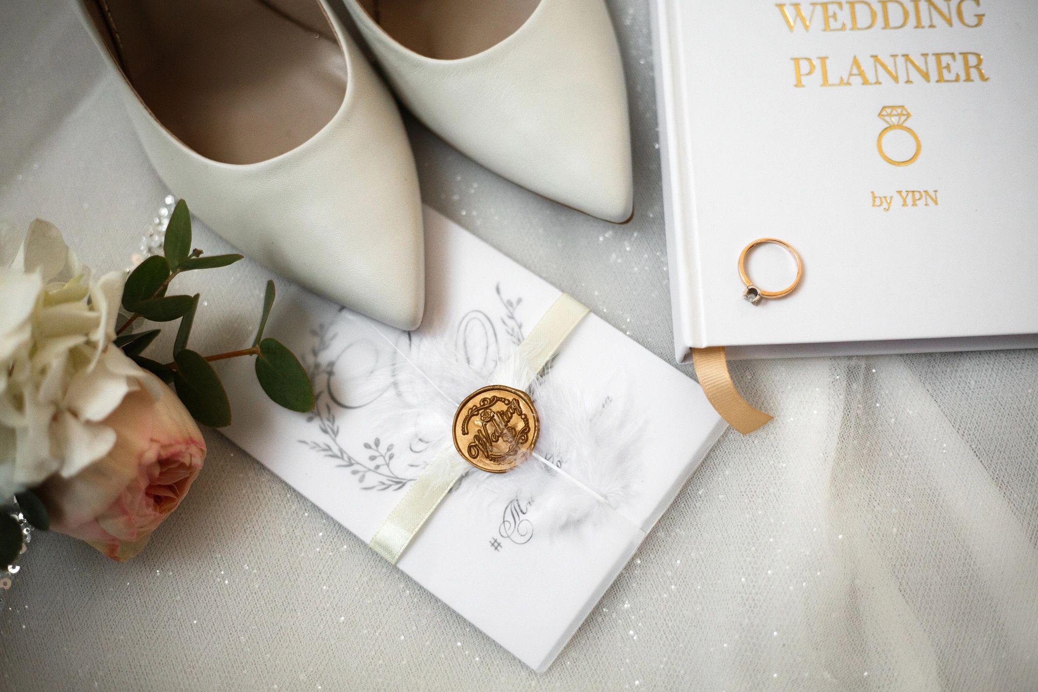 Wedding planning details arranged on a table