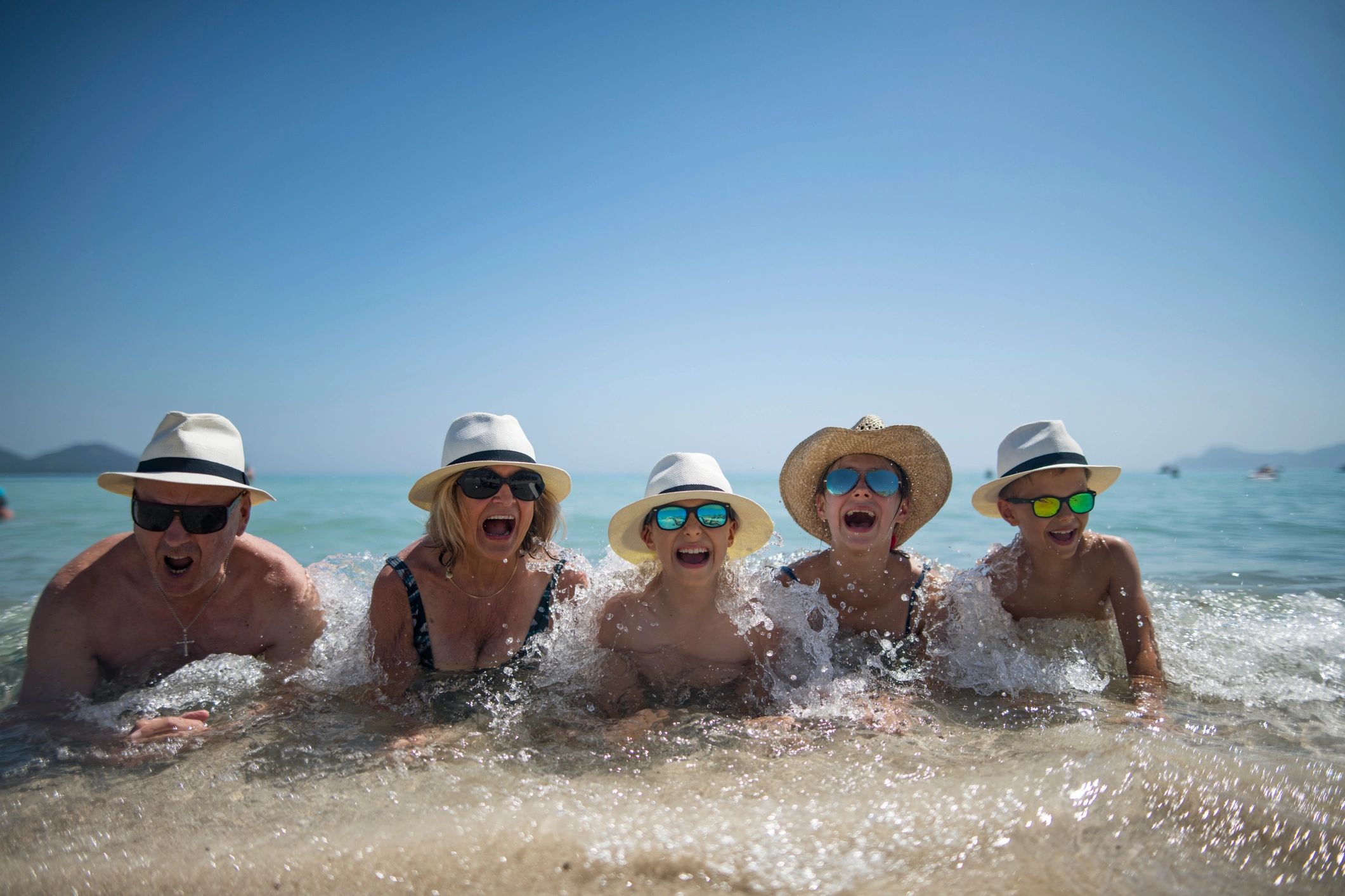 Multi-generational family enjoying a beach vacation