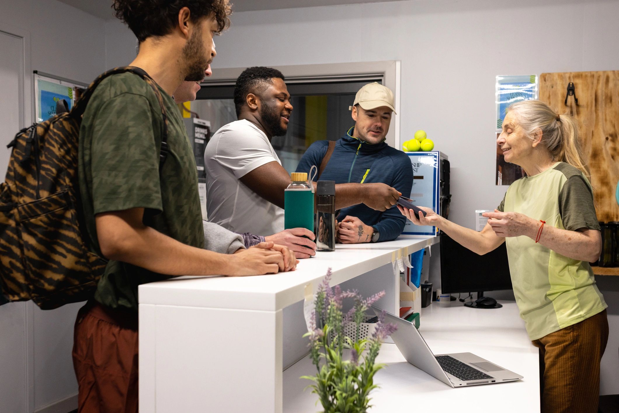 Customer service team assisting guests at a reception desk