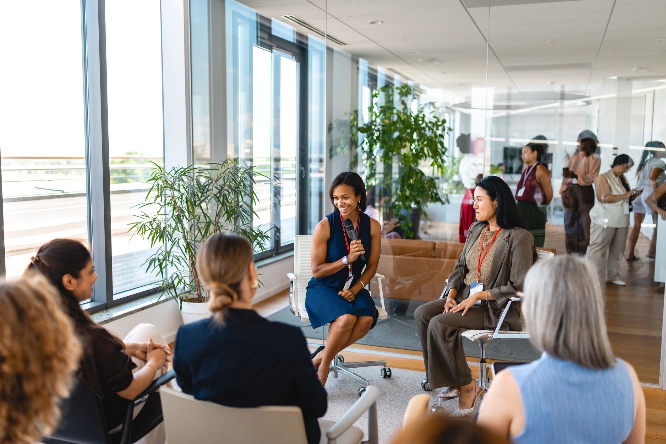 Business professionals participating in a corporate event discussion